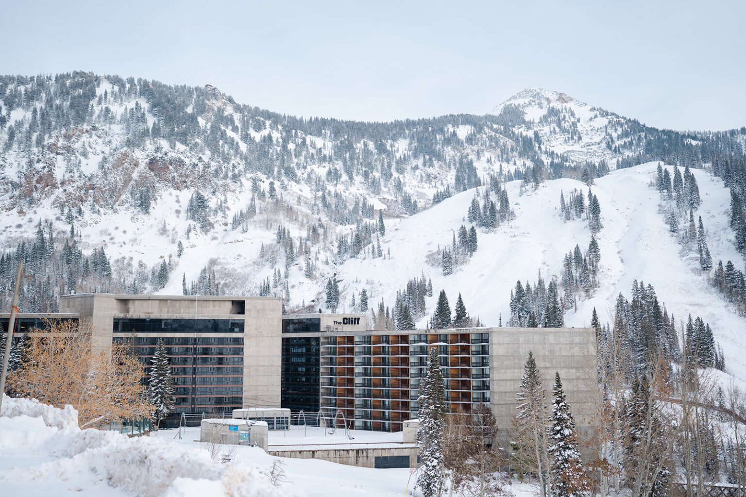 The Cliff Lodge hotel, with snow covered peaks in the background